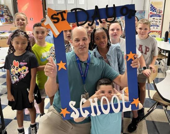 William Papula’s fourth grade class strikes a pose at Golden Hill Elementary.