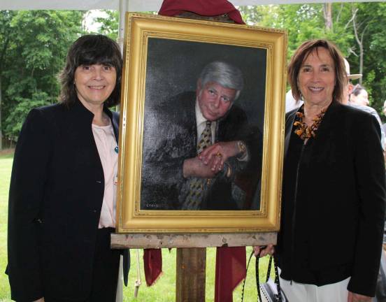 Provided photo Dr. Mary Leahy, CEO of Bon Secours Charity Health System, and Terry Quint flanked the portrait of her husband, Dr. Jerry Quint, which was unveiled May 30 at the Mount Alverno Center in Warwick.