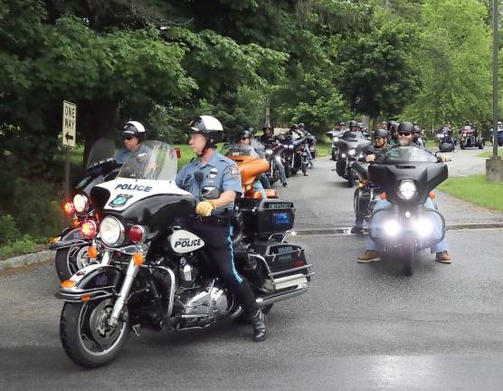 Father Angelo Micciulla (right), a former parochial vicar at Warwick’s RC Church of St. Stephen the First Martyr and now Pastor of Holy Family Parish in Staten Island, returned to join a formation of motorcycle enthusiasts, led by Warwick Police, on a 40-mile ride through local country roads.