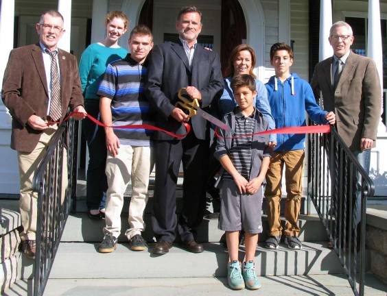 Photo by Roger Gavan On Oct.15, Managing Partner Dan Thompson and members of his family celebrated the first year anniversary of Capacity Coverage of Warwick with a ribbon-cutting ceremony. From left, Town of Warwick Supervisor Michael Sweeton, Warwick Valley Chamber of Commerce board member Elizabeth Cassidy, Cooper Thompson, 17, Dan and Melissa Thompson with their sons Xavier, 10, and Jesse, 14, and Chamber Executive Director Michael Johndrow.