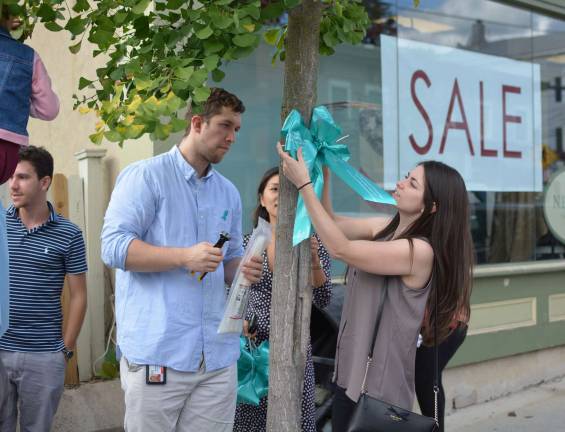 Horizon Family Medical Group/Touro College of Osteopathic Medicine students nd others tied teal ribbons to trees and telephone poles along Main Street in the village to raise awareness of ovarian cancer. The teal ribbons were donated by F.H. Corwin Florist And Greenhouses, Inc. in Warwick.