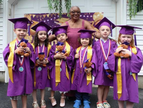 Love Grows Child Care graduates Angelie Costello, Blake Dempster, Connor Dillon, Lukas Pihlava, Natalie Rogers and Roman Rodriguez with owner Cecelia Cenot.