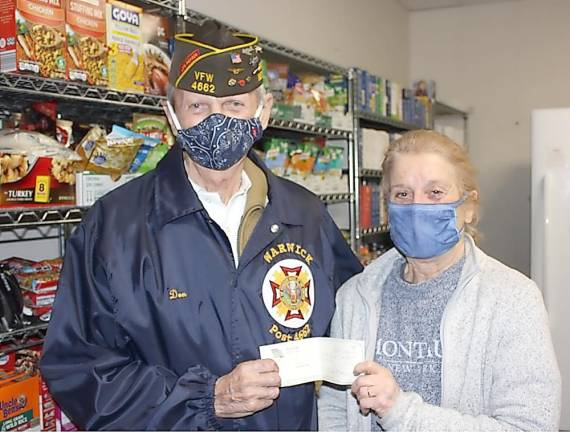 The fourth donation given to the Warwick Ecumenical Food Pantry was received by Theresa Mandracchia and presented by Post Chaplain Donald P. Grenier and Post Vice Commander Carmine Garritano (not pictured).