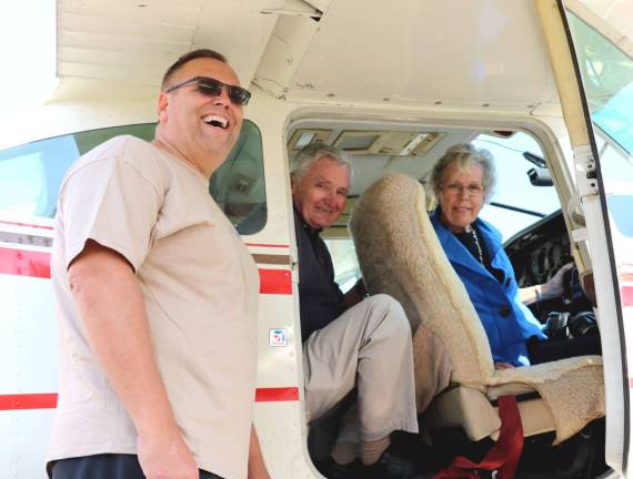 Photo by Roger Gavan On Sunday, Carol Greene and her husband, Dick, had an opportunity to take a spin and a splash down on Greenwood Lake with Steve Kent (left), Cessna regional sales manager and vice president of the Warwick Valley Pilots Association, in his amphibious Cessna aircraft.