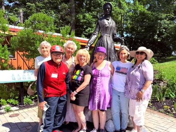Some of the Indivisible planners for Hands Across the Hudson on the Walkway with Walkway Ambassador Fred Schaffer (left).