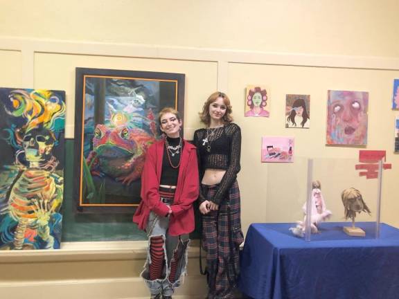 Artists Amanita Bakker, left, and Adella Kuroz showcase their work in the Doc Fry pop-up gallery.