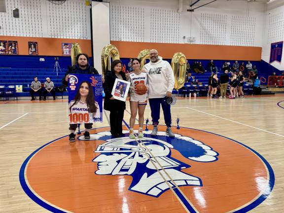 Seward senior Kayla Valenti scores 1000th point as varsity basketball player.