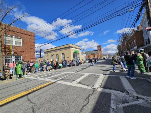 A large crowd gathered along Main Street in Warwick in preparation for the 2024 St. Patrick’s Day Parade.