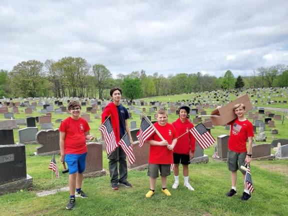 Boy Scouts laying 1400 flags on veterans’ graves seek assistance