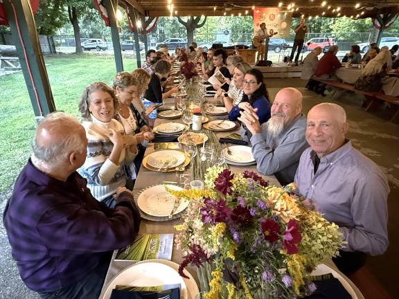 Guests seated Tuscan style during dinner