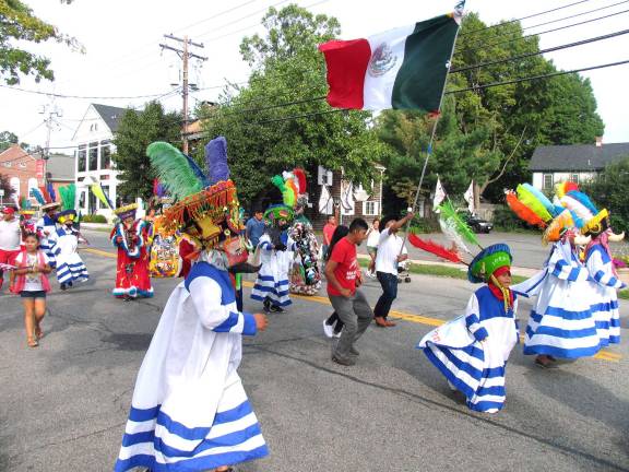 On Sunday afternoon, Sept. 18, a colorful assembly of members of the Spanish Ministry of the Warwick Reformed Church formed a line of march from the church down Main Street, in the Village of Warwick, to the Railroad Green.