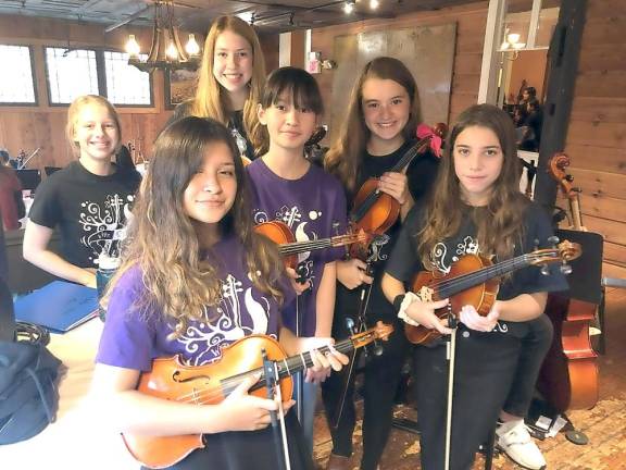 Wire Choir students perform two hours of live music in surround sound during brunch provided by Michael DiMartini at the Landmark Inn.