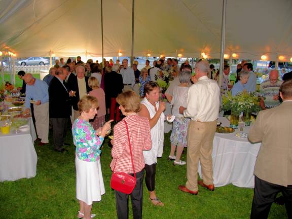 Guests had a choice of outdoor seating as well as gathering under the huge tent. And while enjoying the music of the Warwick Valley High School Chamber Strings, the comfortable temperatures and clear blue skies, they sampled good food, wines and other refreshments donated by local businesses and restaurants.