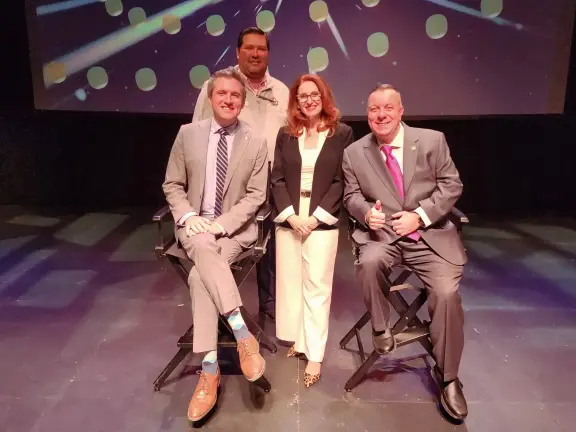 Orange County Chamber of Commerce President Heather Bell (center) with NYS Sen. James Skoufis (left) and NYS Assemblyman Karl Brabenec (right) and event moderator Daniel Ortega.