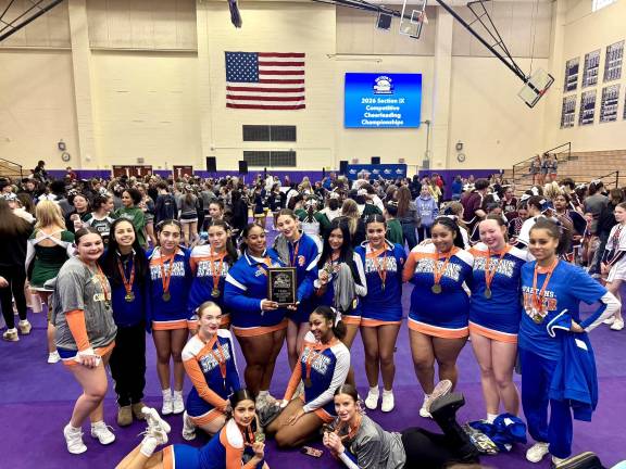 Seward Cheerleaders celebrate section 9 win.