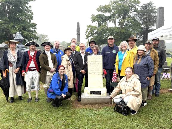 Commemorative plaque (close-up) and placement of the plaque by costumed Nicholas Fitzgerald from Boston Tea Party Ships Museum; and gathering of townspeople surrounding Thomas Cowdrey’s gravestone in the Warwick Cemetery on Colonial Avenue.