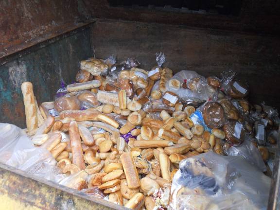 Photo by Alexis Tarrazi Outdated or expired bakery goods are disgarded by Shoprite in Newton into recycling bins provided by AG Choice to be turned into animal feed.