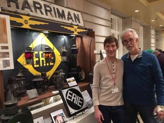 Provided photo Alex Prizgintas with his father in front of their &quot;Erie Railroad&quot; display at the Key, Lock, &amp; Lantern Convention in Scranton, Pa. The Harriman sign on the top of the display actually came from the Harriman Train Station, which sadly was demolished a few years ago.