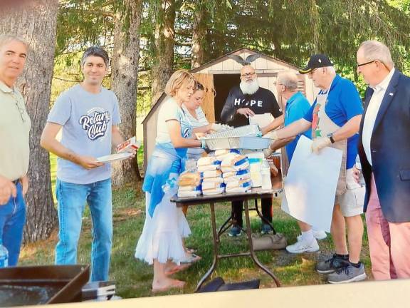 Warwick Valley Rotarians served hot dogs before the event.
