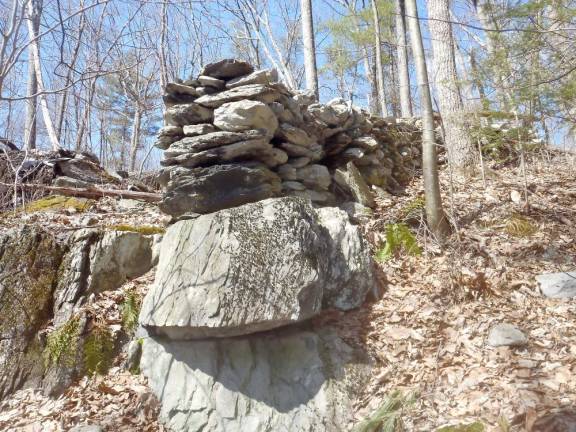 An example of a “linear feature” ceremonial stone landscape: a wall of stone that ends at an overhang, captured in Bushkill, Pennsylvania.