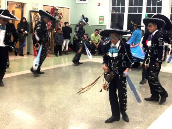 A special "Danza," was performed to honor he Virgin of La Guadalupe by three different groups: Los Chinelos de San Pedro who came from New York City, The Comparza de Chinelos from Middletown and Los Charros Negros, all in full colorful costumes.