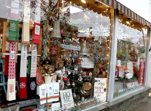 Many of the downtown shops' windows, like that of Etched in Time, were decorated for the season.