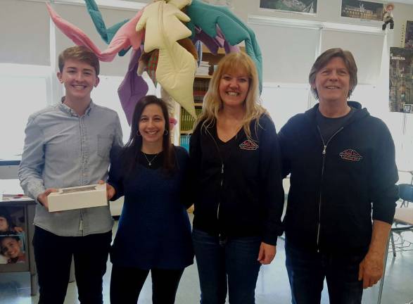 Pictured from left to right are Warwick Valley High School student Gregory Knob, his teacher Susan Brofman and the owners of Noble Pies.