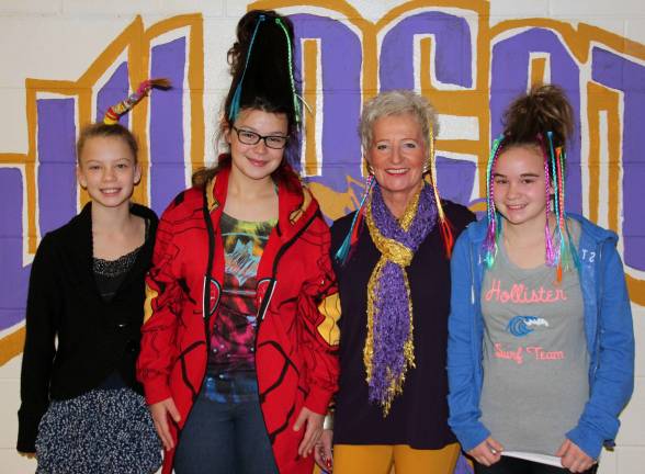 Photo by Michelle Ryder Last Friday, students, faculty and staff from the Warwick Valley Middle School participated in &quot;Crazy Hair Day&quot; and raised $1,000 for Arms Wide Open Childhood Cancer Foundation. Pictured here are Chloe Hazard, Lizzie Lepre, Mrs. Sue Filingeri and Christy Bonsignore.