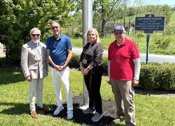 L to R: Four officials and flag raising: Village of Warwick Mayor, Michael Newhard; Old Stone House Inn &amp; Restaurant owner, Arek Kwapinski; Eileen Sciscoe, member Greenwood Lake VFW and Honorary Graduate of West Point; Russ Kowal, Town of Warwick Councilman.