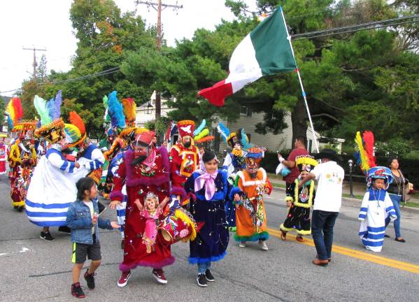 On Sunday afternoon, Sept. 18, a colorful assembly of members of the Spanish Ministry of the Warwick Reformed Church formed a line of march from the church down Main Street, in the Village of Warwick, to the Railroad Green.