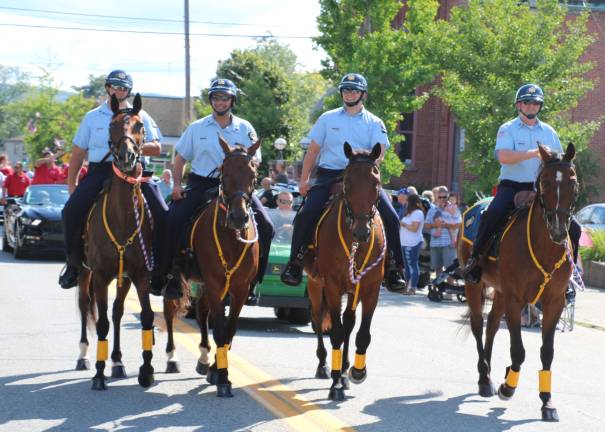 Photo by Ed Bailey and Roger Gavan Members of the New York State Correctional Services mounted patrol ride on horseback during the parade.