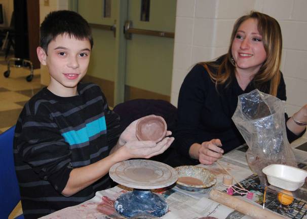 Kids enjoy making hands-on clay projects at Empty Bowls.