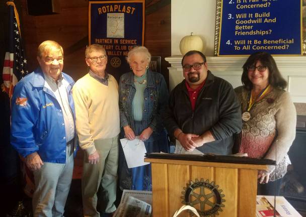 Rotarians induct two new members