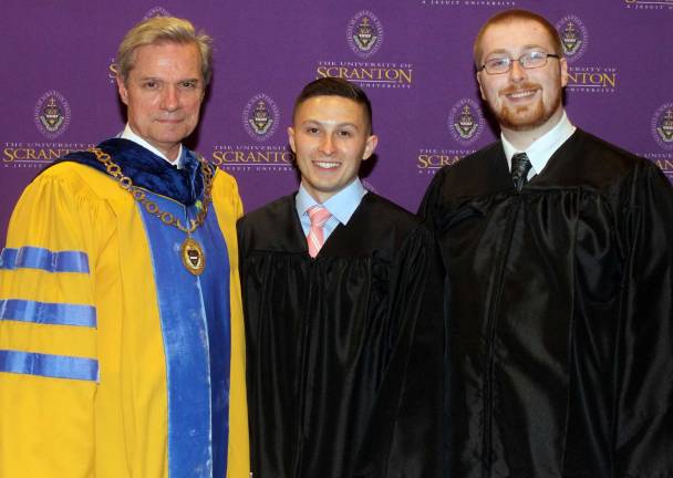 Photograph provided by the University of Scranton Standing from left are Donald R. Boomgaarden, Ph.D., provost and senior vice president for academic affairs at the University of Scranton; Thomas G. Holtman Jr. of Warwick, who received the university's Excellence in Operations Management Award; and Daniel J. Podeszwa of Warwick, who received the university's Excellence in Biochem Award.