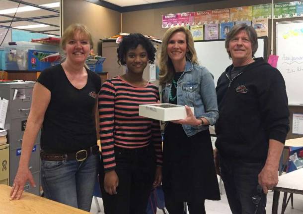 The owners of Noble Pies flank Warwick Valley Middle School student Junique Nicholls and her teacer Danielle Diglio.