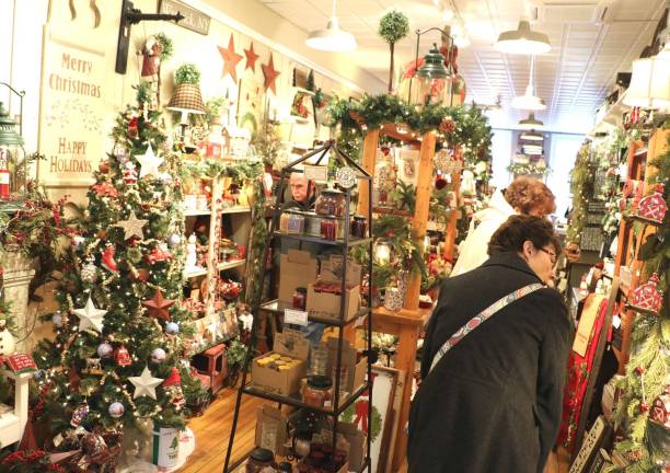 Photos by Roger Gavan Many of the downtown shops like Frazzleberries were decorated for the season and featured special offers and events.