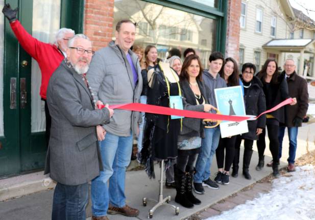Photo by Roger Gavan On Friday, Feb. 3, Mayor Michael Newhard (far left) and members of the Warwick Valley Chamber of Commerce joined Janice Brigante (center), her family, friends, clients and associates to celebrate the official grand opening of Janice Brigante Women's Clothing Design Studio on the second floor at 7 West St.