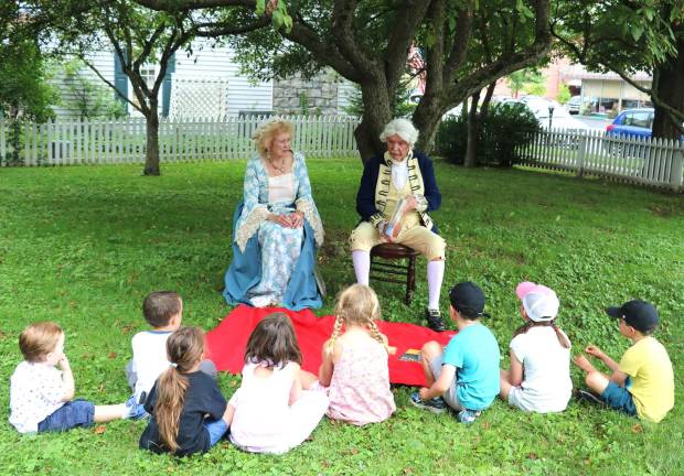 After arriving at Lewis Park and greeting the visitors, the Washingtons took their seats on a fine rug, as was the custom of that day, and fielded questions from the youngsters present.