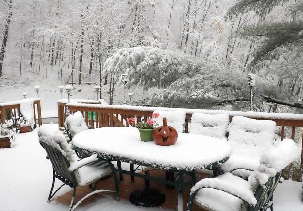 Trick or treat. On Friday, Oct. 30, the day before Halloween, residents in the higher elevations surrounding the Town of Warwick awoke to a picturesque but somewhat early accumulation of three to four inches of fresh snow. The summer furniture and flowers on this deck in the Mount Peter area had yet to be put away when covered with snow.the day before Halloween. Photo by Roger Gavan.