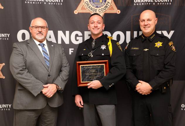 Division of Criminal Justice Services Deputy Commissioner Michael Bonse, Deputy Joseph Carey, and Sheriff Paul Arteta.