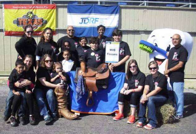 Dr. Vip Patel (back) of Warwick Valley Dental is surrounded by his staff and friends who sponsored and participated in the JDRF Walk for the Cure. The practice raised more than $1,300 toward diabetes research.