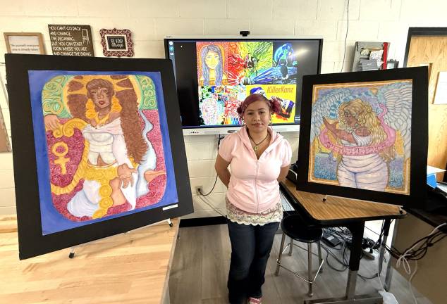 WVHS Senior Jaida Martinez poses with her artwork.