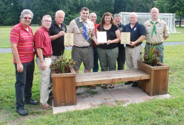 Pictured from left to right are: Warwick Town Councilman Russell Kowal, Warwick Town Supervisor Michel Sweeton; Denis Mulcahy, founder of Project Children; Eagle Scout Shea Gormley; Deputy Town Supervisor James Gerstner; Kathleen Holder, president Greenwood Lake Gaelic Cultural Society; Sam Gormley, father of Shea; Vincent Hallinan, president of Greenwood Lake Soccer Club; and Jason Fox, the Scoutmaster of Troop 477.