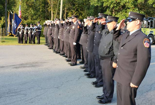 Members of the WFD present arms during the singing of the National Anthem.