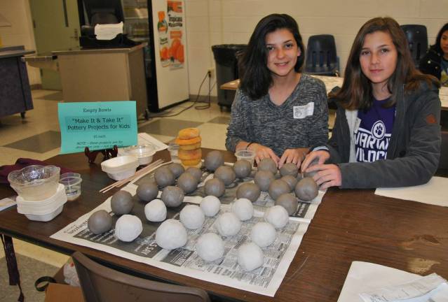 Photos by Louise Hutchison Warwick Valley High School Empty Bowls Club members prepare clay balls for kids' pottery projects.