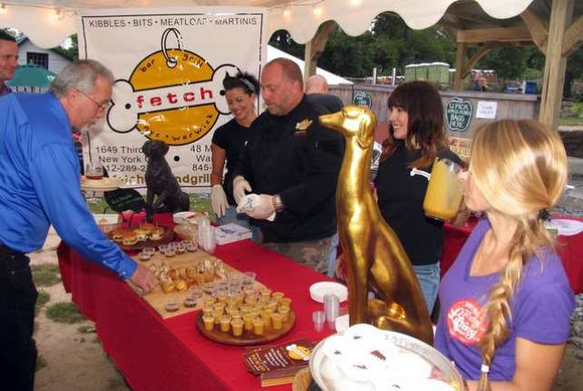 Fetch owner Adam Powers works alongside his staff.