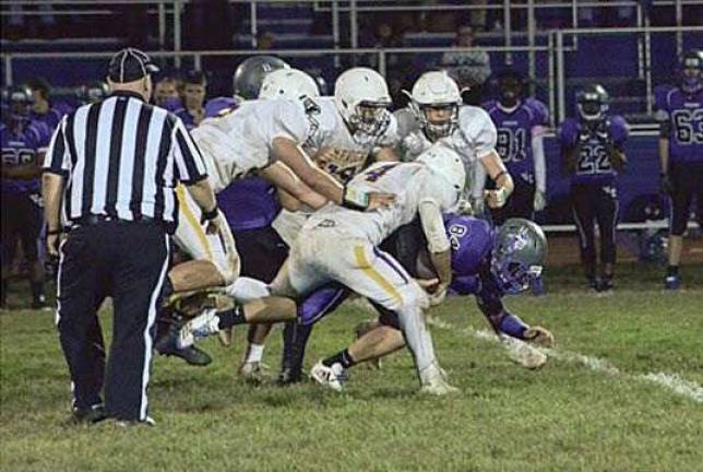 Photo by Al Konikowski The Warwick Valley defense was in playoff mode last Friday in the Wildcats' victory over Valley Central. With the win, the team secured the league title and will face the Middletown Bears on Oct. 20 at home in Warwick.