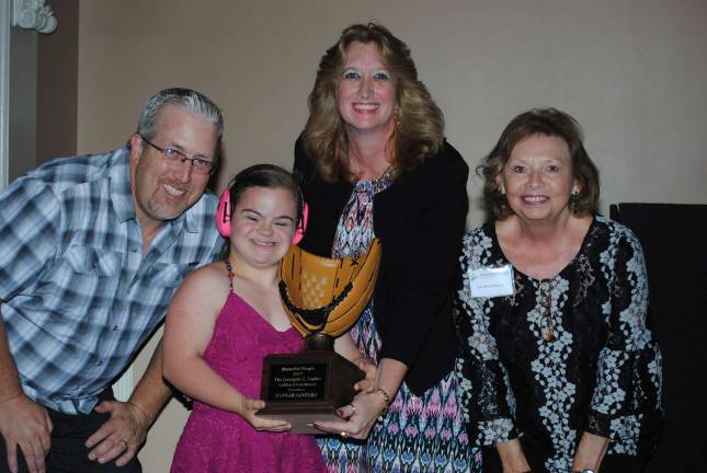 Photo by Stacy Orzell Hannah Santuro, an athlete with Orange County's Miracle League since 2010, is this year's Golden Glove Award Winner. She is pictured here with Beautiful People Founder Peter Ladka, Volunteer of the Year Holly Borzacchiello and Beautiful People Director Jan Brunkhorst.