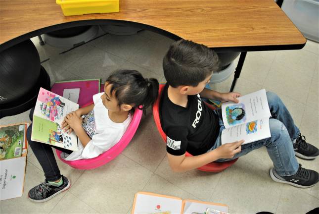 Photos provided by WVDS Park Avenue first-graders Lucianna Rivera and Landon Tarazona choose humorous stories and scoop seats for their independent reading time.