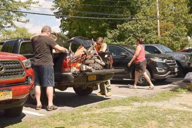Residents of the hamlets, villages and town of Warwick dropped off donations on Saturday. Volunteers helped donors unload their vehicles and carried items onto the basketball court.
